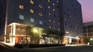 A multi-story hotel with a modern design, featuring a prominent 'Ibis' sign at the top. - ibis Ambassador Seoul Insadong (Seoul)