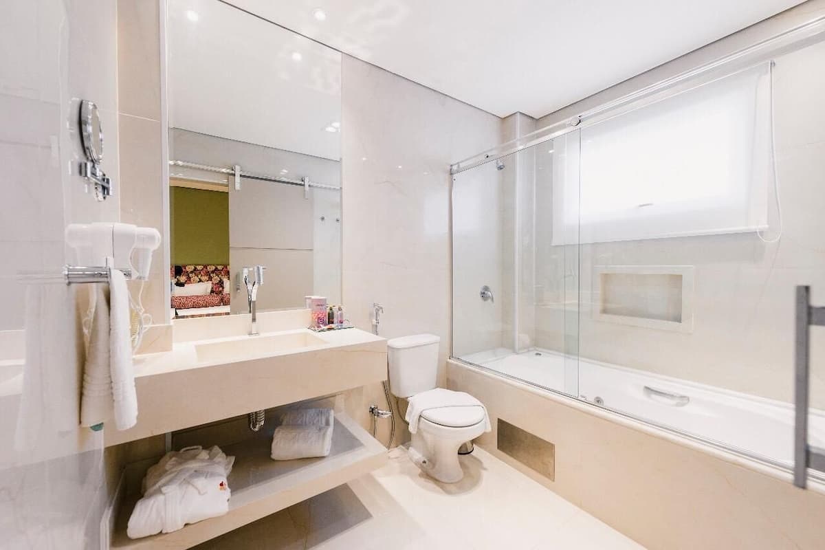 suite privilege | bathroom | hair dryer, towels, soap, shampoo