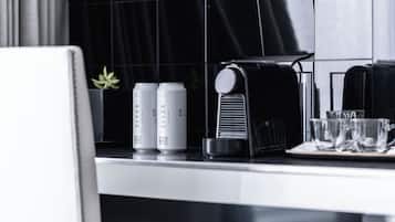 A kitchen counter with two cans of 'SLVDR' and a coffee machine.