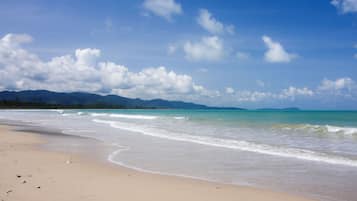 On the beach, sun-loungers, beach towels