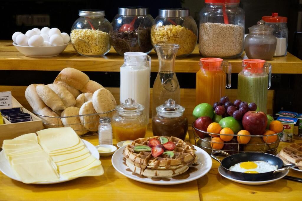 A breakfast buffet with various food items and beverages.