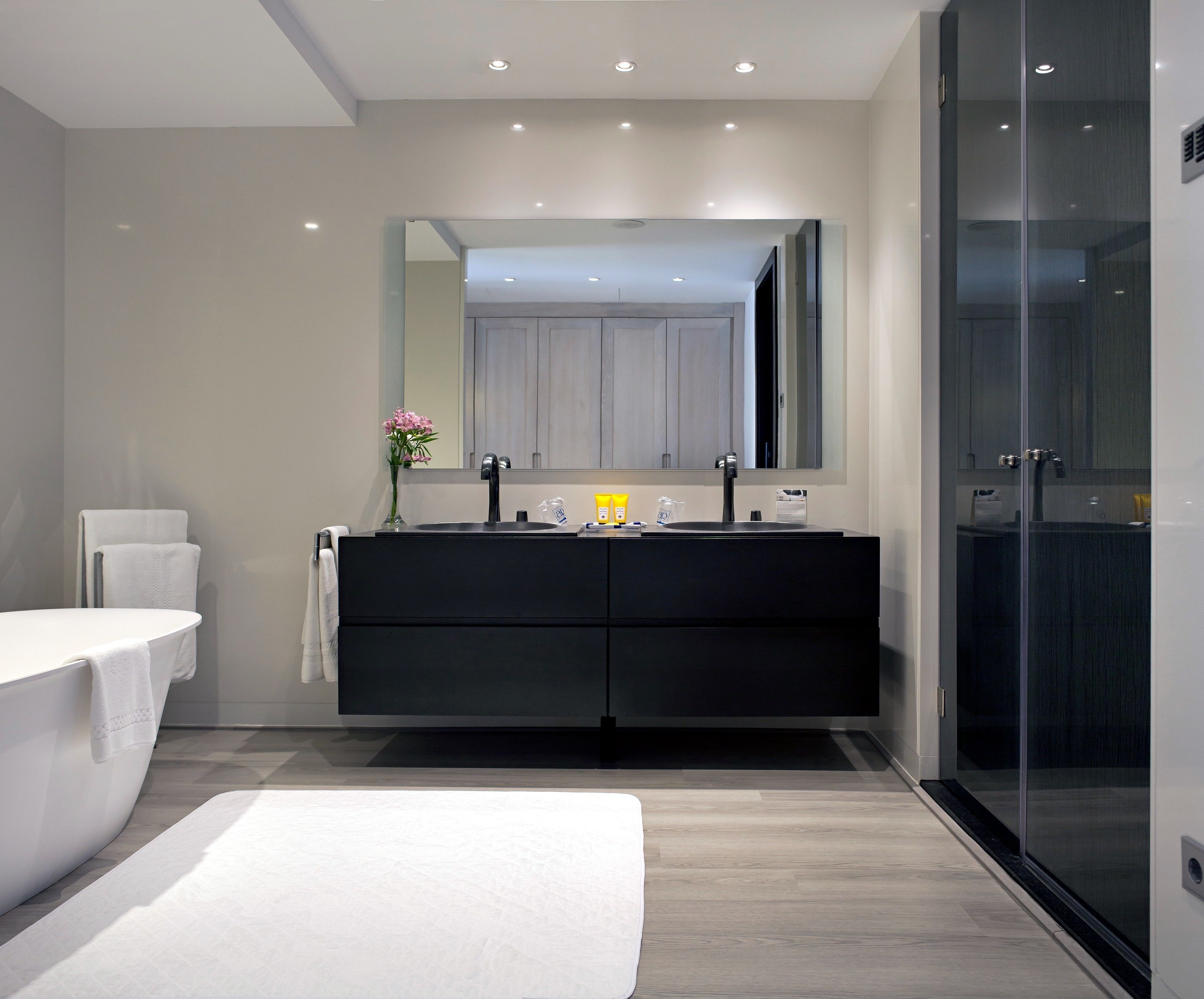 separate bathtub and shower, deep-soaking bathtub, rainfall showerhead