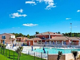 Seasonal outdoor pool, open 9:00 AM to 8:00 PM, pool loungers