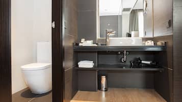 Deep-soaking bathtub, rainfall showerhead, eco-friendly toiletries