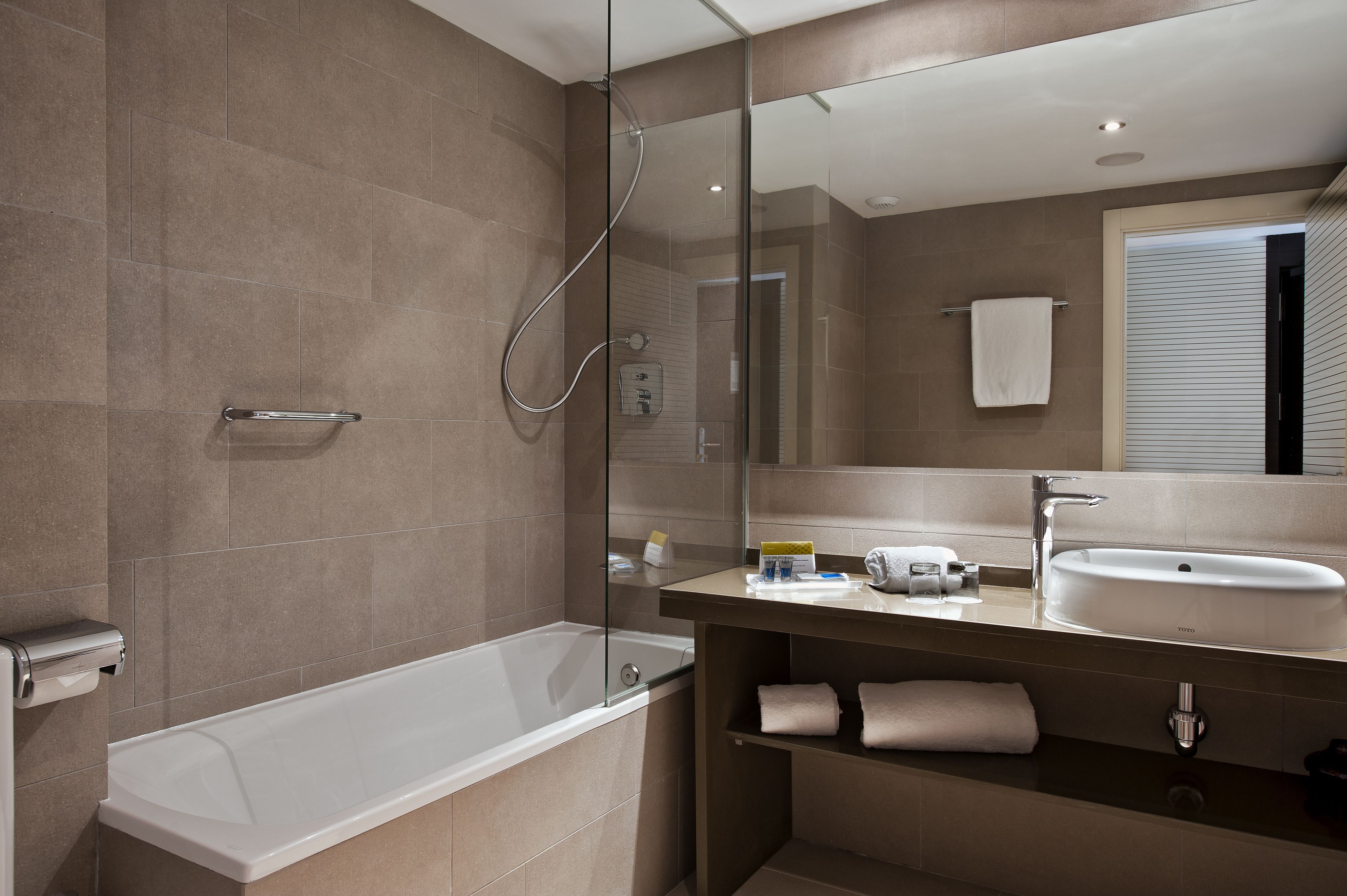 deep-soaking bathtub, rainfall showerhead, eco-friendly toiletries