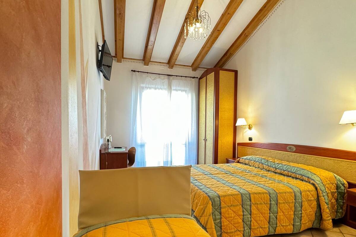 deluxe triple room | frette italian sheets, premium bedding, in-room safe, desk