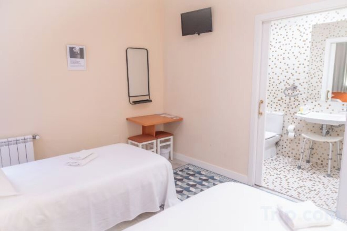 Premium bedding, down comforters, desk, laptop workspace