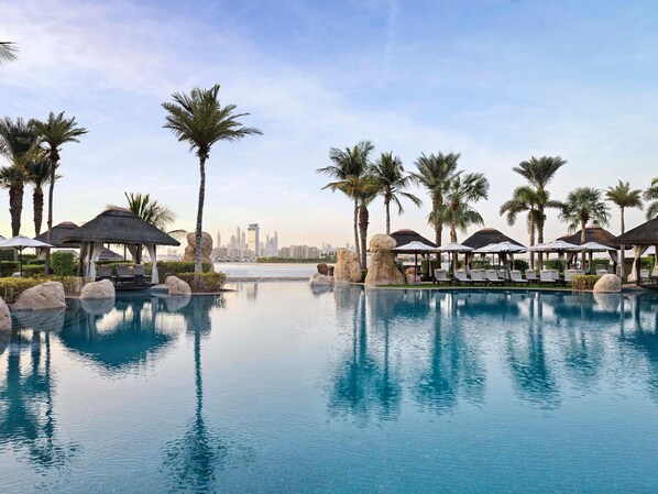 5 outdoor pools, open 9:00 AM to 6:00 PM, pool cabanas (surcharge)