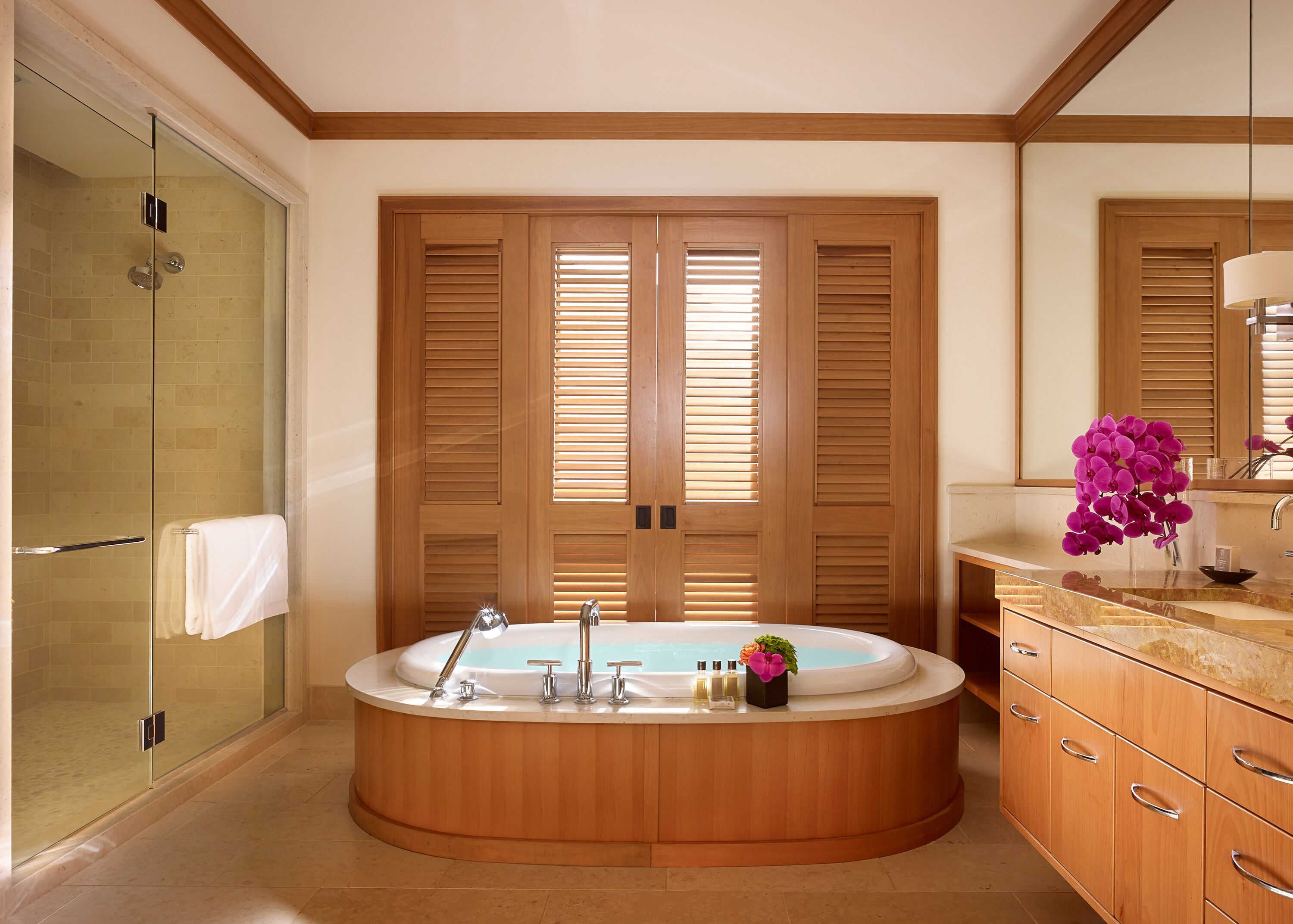 separate bathtub and shower, rainfall showerhead, designer toiletries