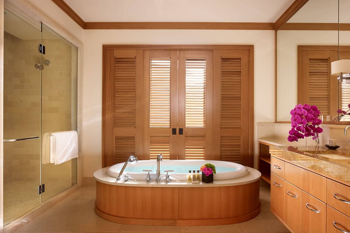 separate bathtub and shower, rainfall showerhead, designer toiletries