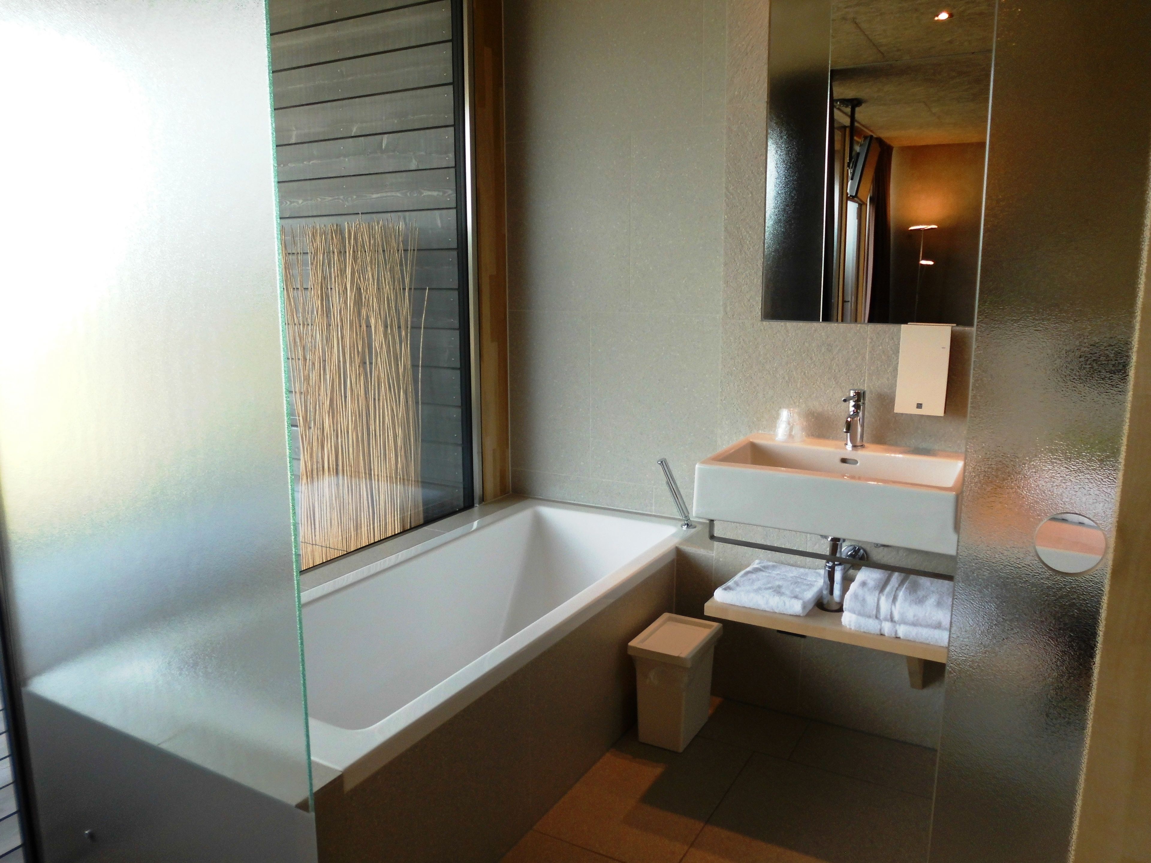 panoramic room | bathroom | rainfall showerhead, free toiletries, hair dryer, heated floors