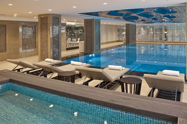 Indoor pool, open 10:00 AM to 10:00 PM, pool loungers