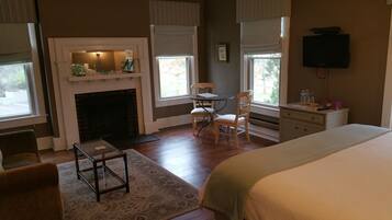 Superior Suite, 1 King Bed, Non Smoking (Hearthside) | Living area | 25-inch TV with satellite channels, DVD player