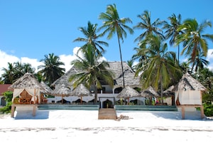 Private beach, white sand, sun loungers, beach umbrellas