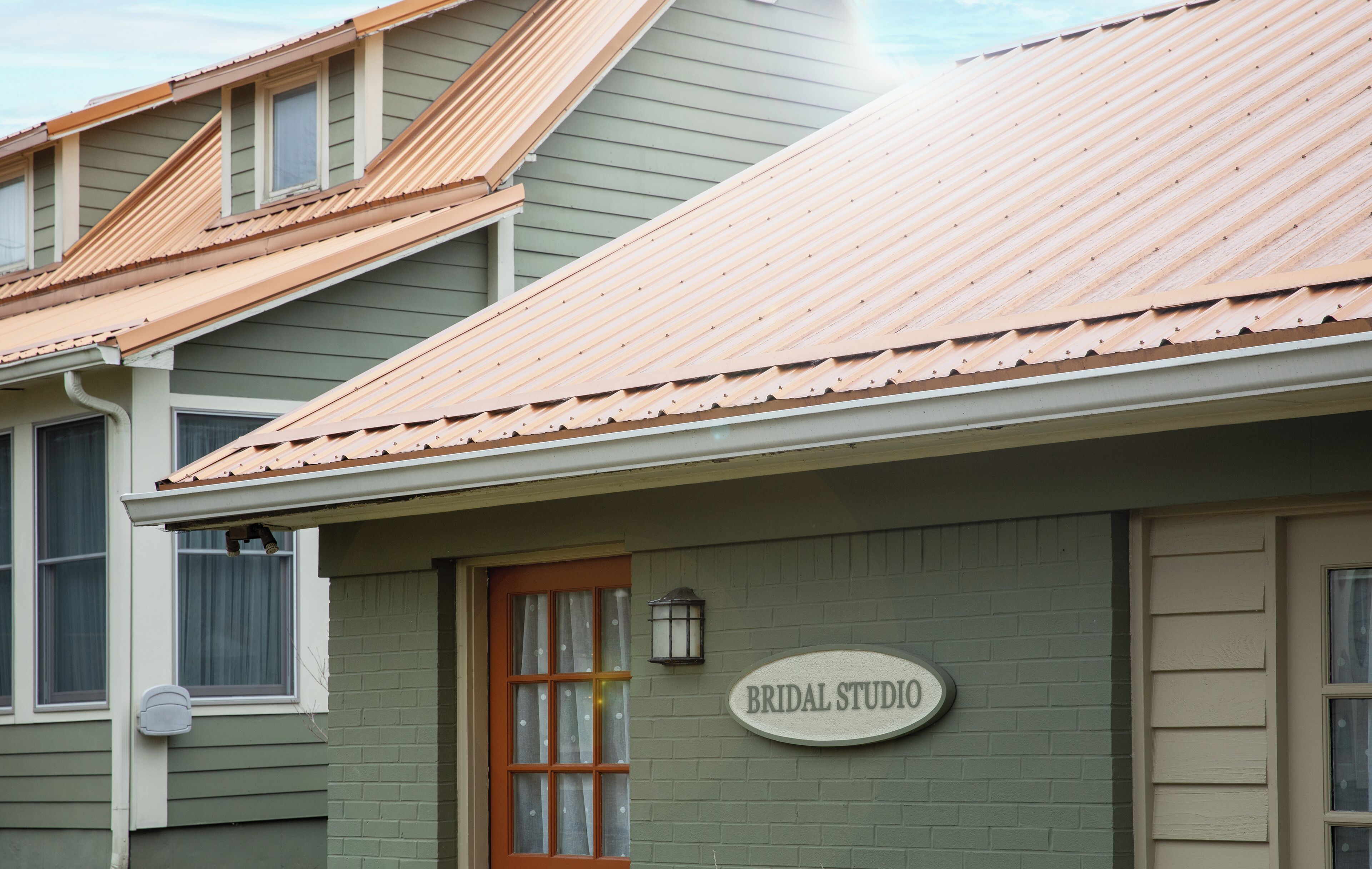 A building with a sign that reads "BRIDAL STUDIO."