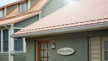 A building with a sign that reads "BRIDAL STUDIO."