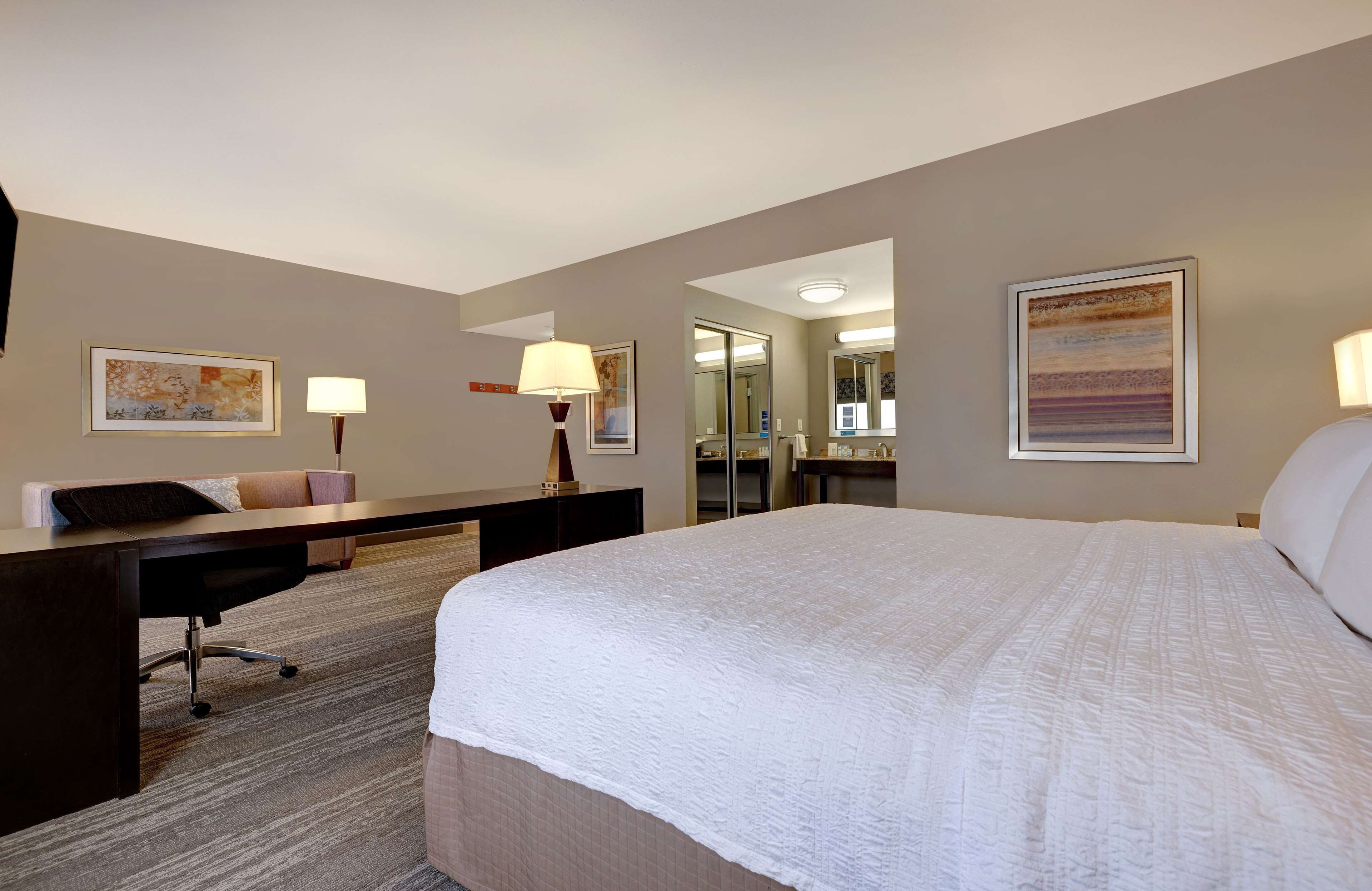 premium bedding, desk, laptop workspace, blackout curtains