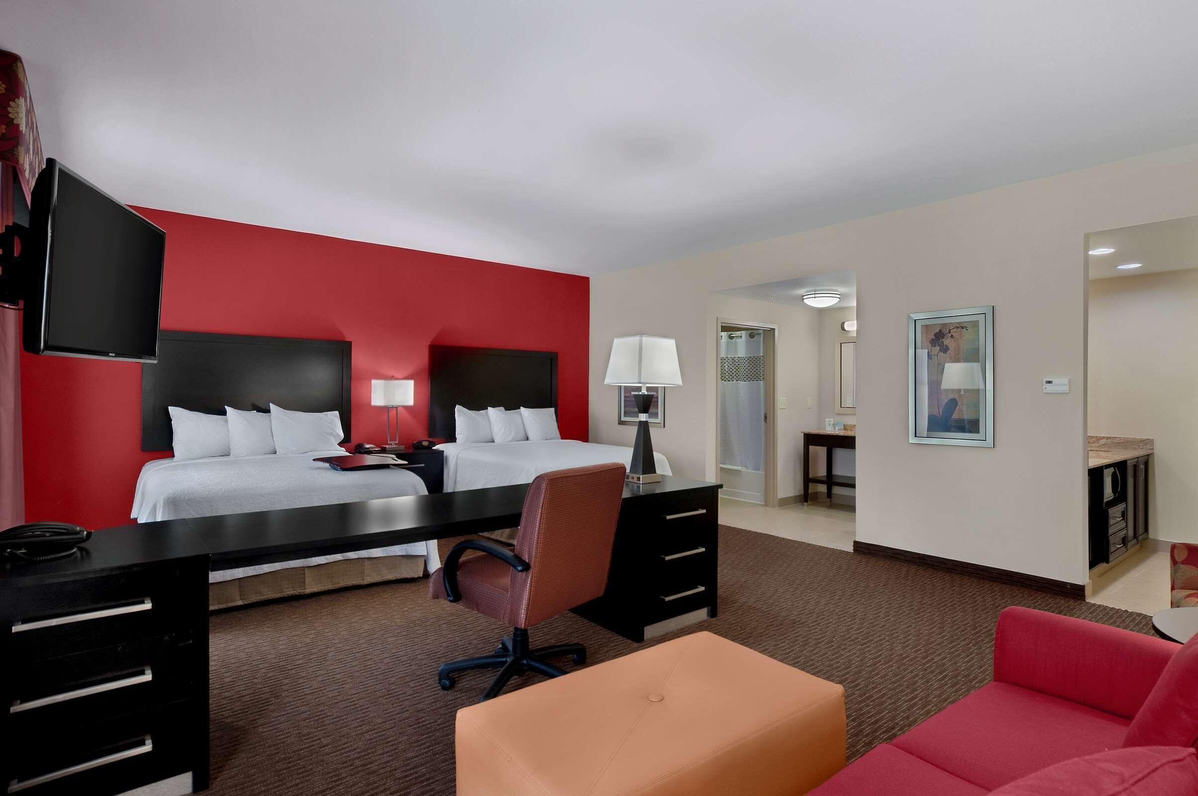 Premium bedding, desk, laptop workspace, blackout drapes