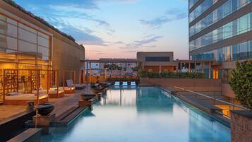 Outdoor pool, open 6 AM to 9:00 PM, pool loungers
