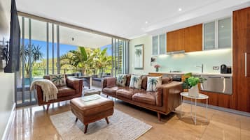 Deluxe Apartment | Living area | 55-inch Smart TV with digital channels, TV, Netflix