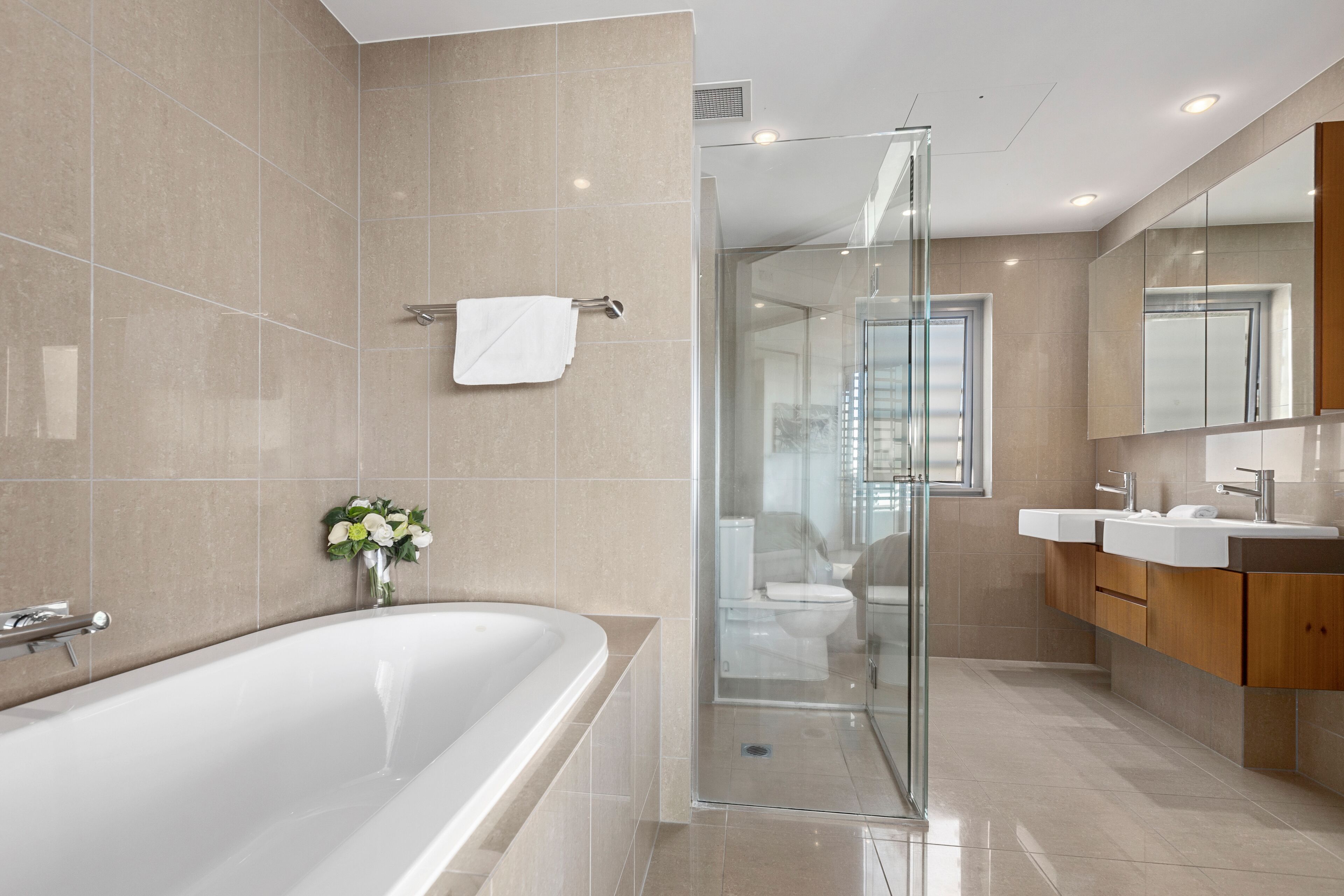 separate bathtub and shower, deep-soaking bathtub, hair dryer, towels