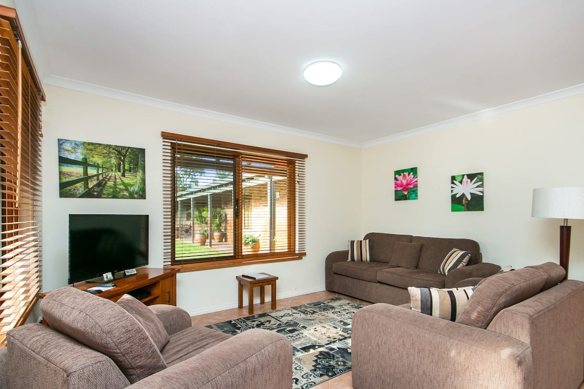 Family Suite, 2 Bedrooms, Private Bathroom, Ground Floor | Living area | Flat-screen TV, DVD player