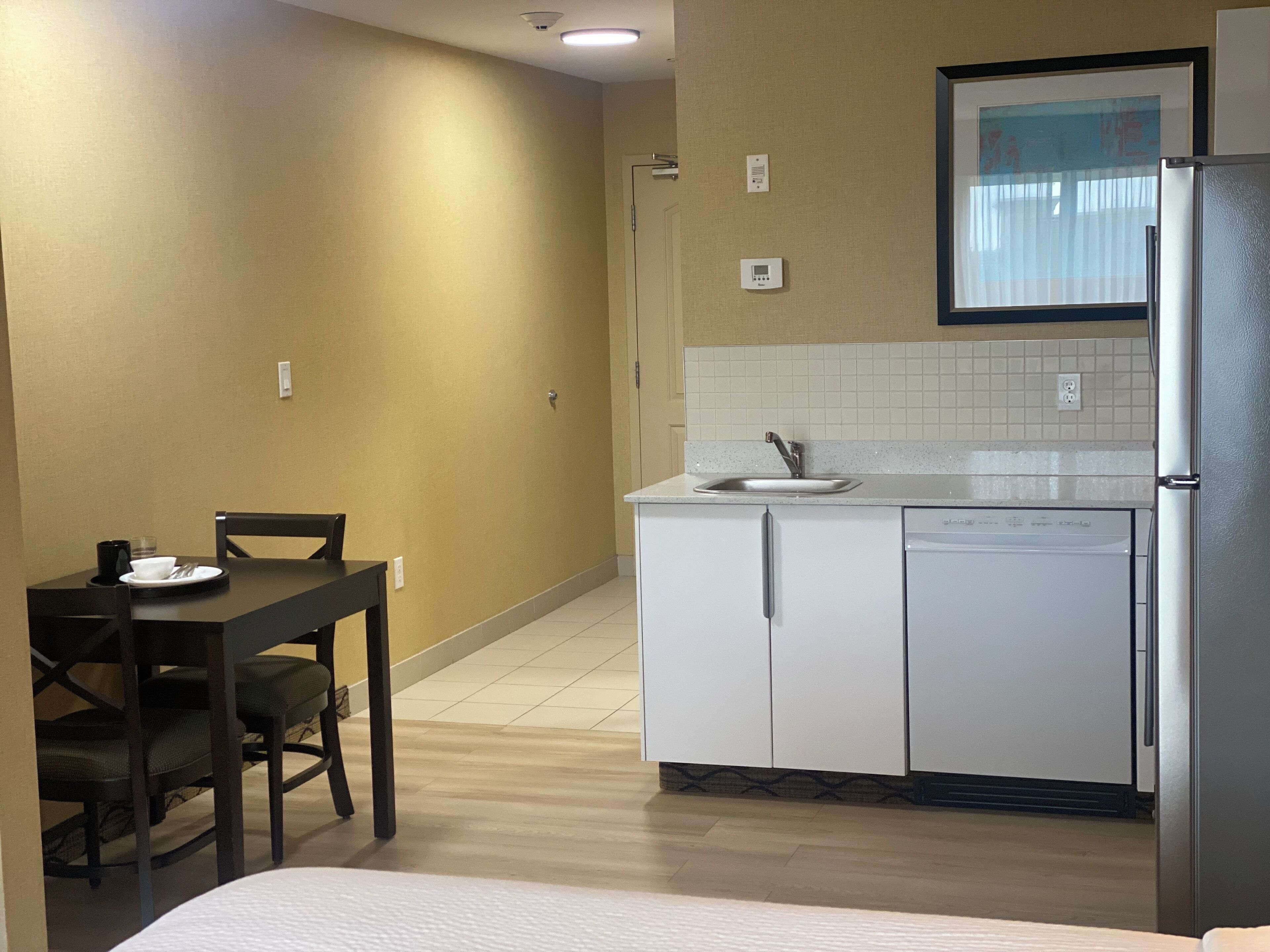 suite, 1 king bed, non smoking, kitchenette | in-room safe, desk, iron/ironing board, free wifi