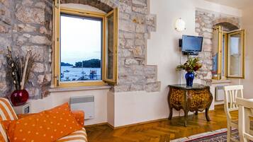 Standard Apartment, 1 Bedroom, Sea View | Living area | Flat-screen TV