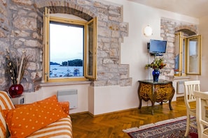 Standard Apartment, 1 Bedroom, Sea View | Living area | Flat-screen TV - Residence La Carera (Rovinj)