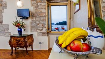 Standard Apartment, 1 Bedroom, Sea View | Living area | Flat-screen TV