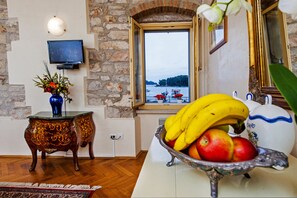 Standard Apartment, 1 Bedroom, Sea View | Living area | Flat-screen TV - Residence La Carera (Rovinj)