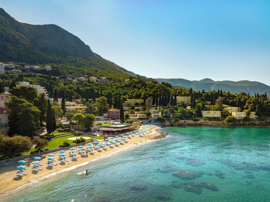 On the beach, sun-loungers, beach umbrellas, beach bar