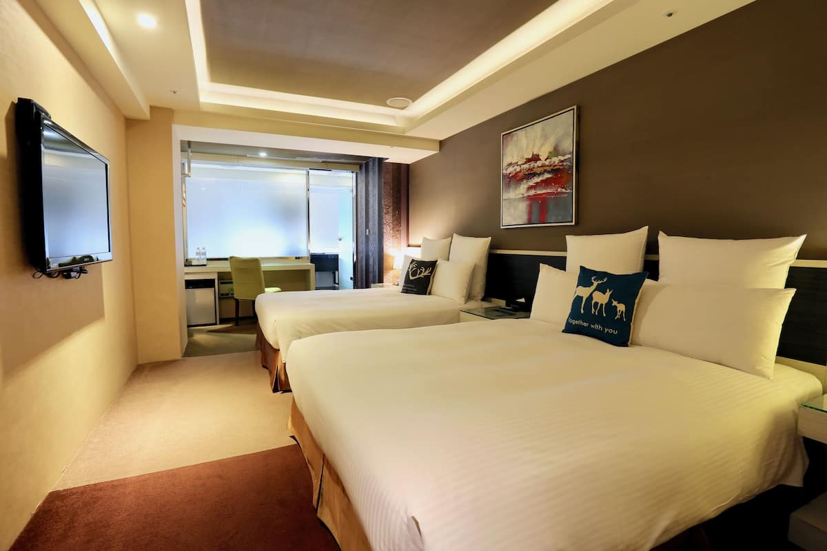 Family Room | Premium bedding, down comforters, pillowtop beds, in-room safe