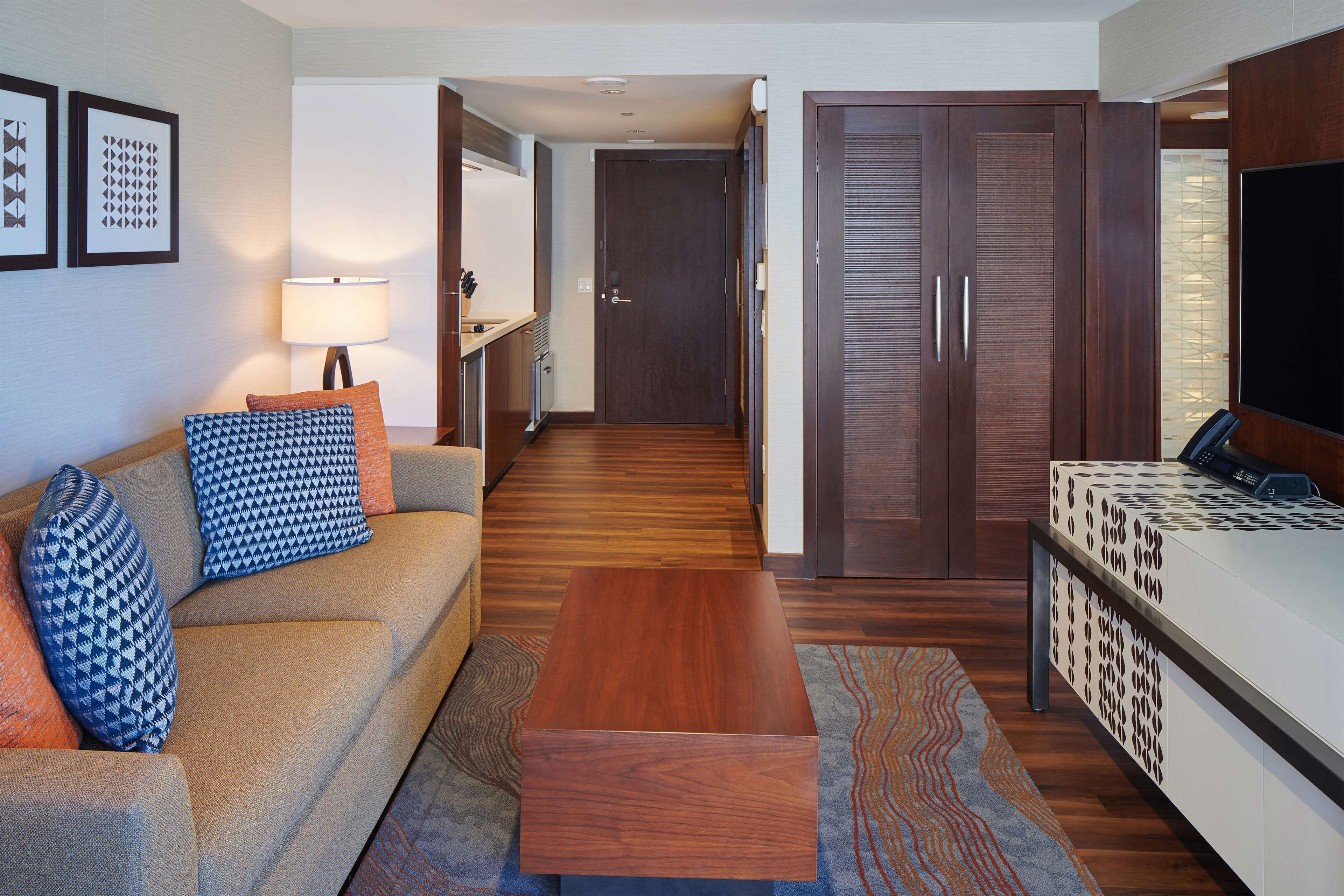 suite, 1 bedroom, accessible, non smoking (1 king bed, roll-in shower) | living area | 50-inch lcd tv with cable channels, tv, ipod dock