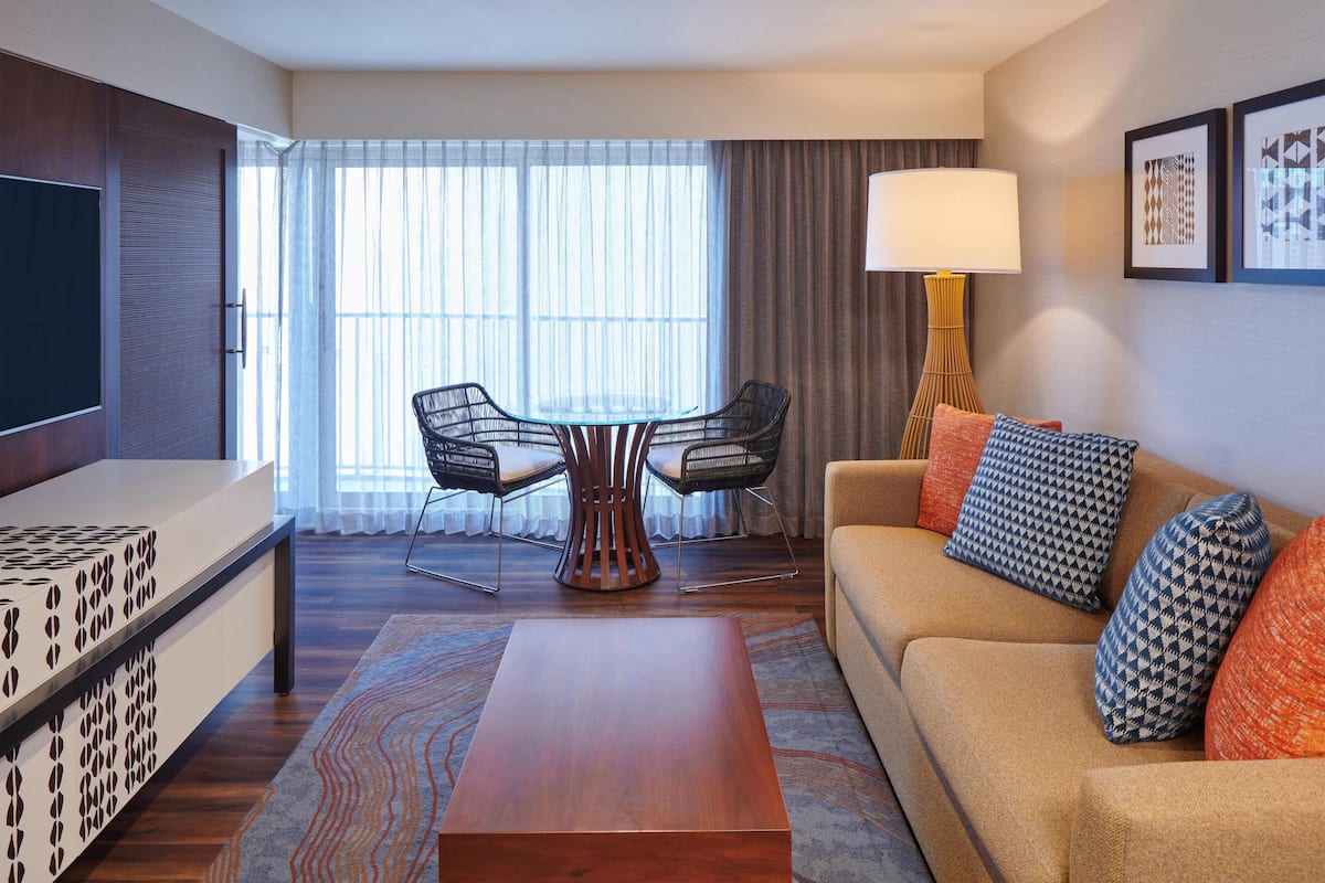 Suite, 1 Bedroom, Accessible, Non Smoking (Mobility & Hearing, Roll-in Shower) | Living area | 50-inch LCD TV with cable channels, TV, iPod dock