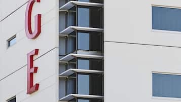 A modern building with a prominent 'RYDGES' sign on the facade.