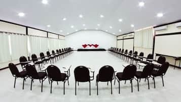 A conference room with a long table and chairs arranged for a meeting.