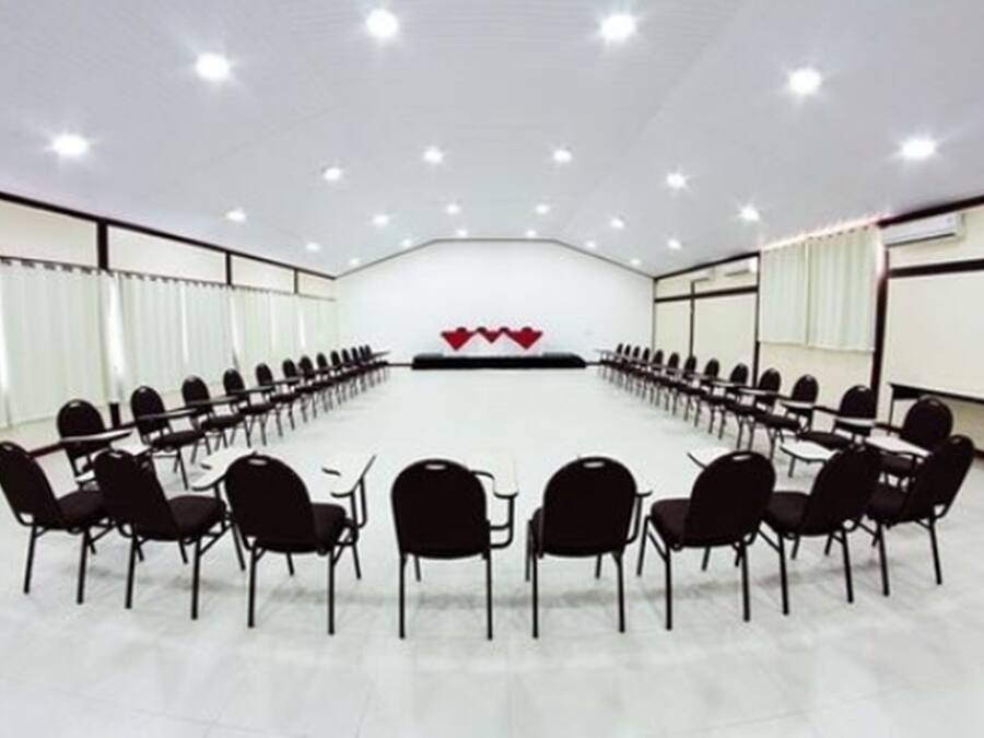 A conference room with a long table and chairs arranged for a meeting.