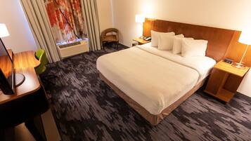 Pillow-top beds, desk, blackout curtains, iron/ironing board