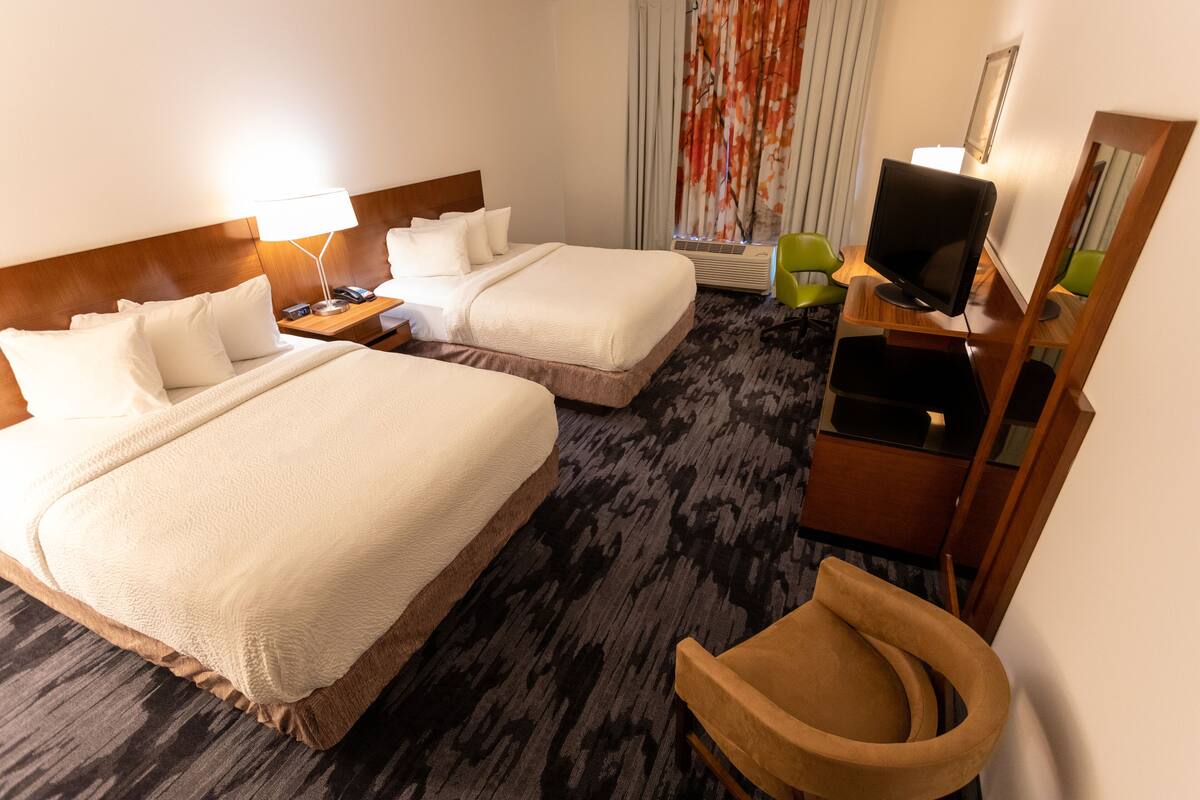 pillow-top beds, desk, blackout curtains, iron/ironing board