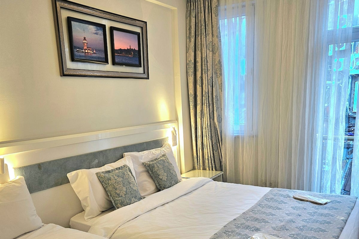 Superior Triple Room, 1 Bedroom | Minibar, in-room safe, soundproofing, iron/ironing board