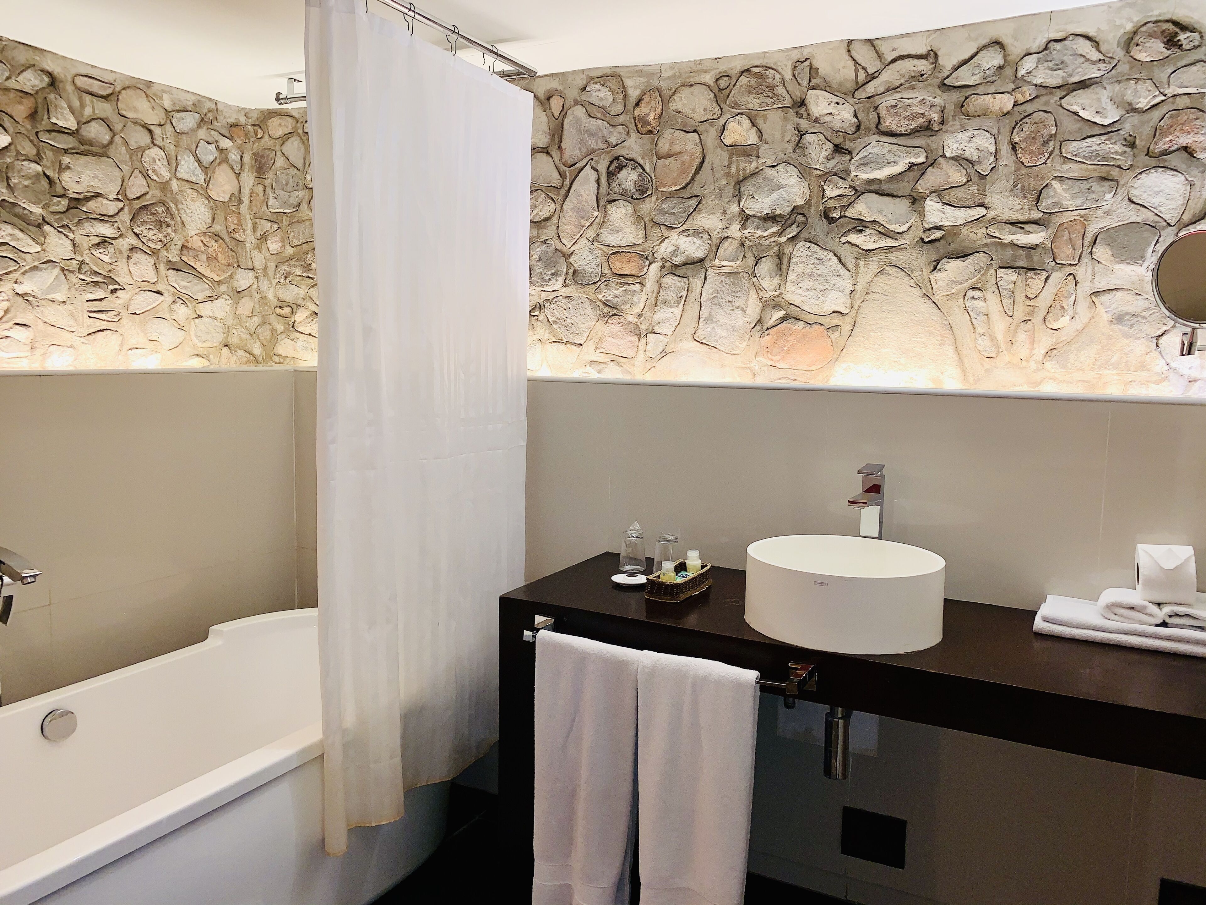 rainfall showerhead, designer toiletries, towels