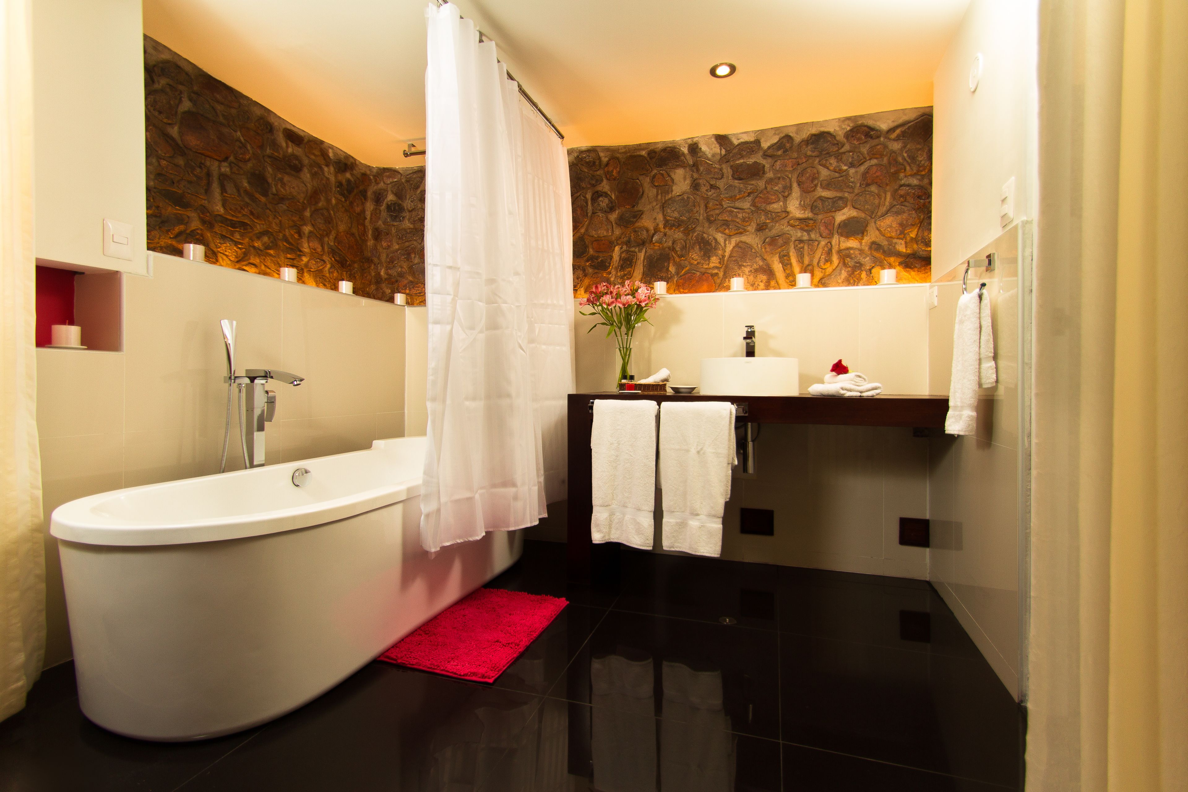 rainfall showerhead, designer toiletries, towels