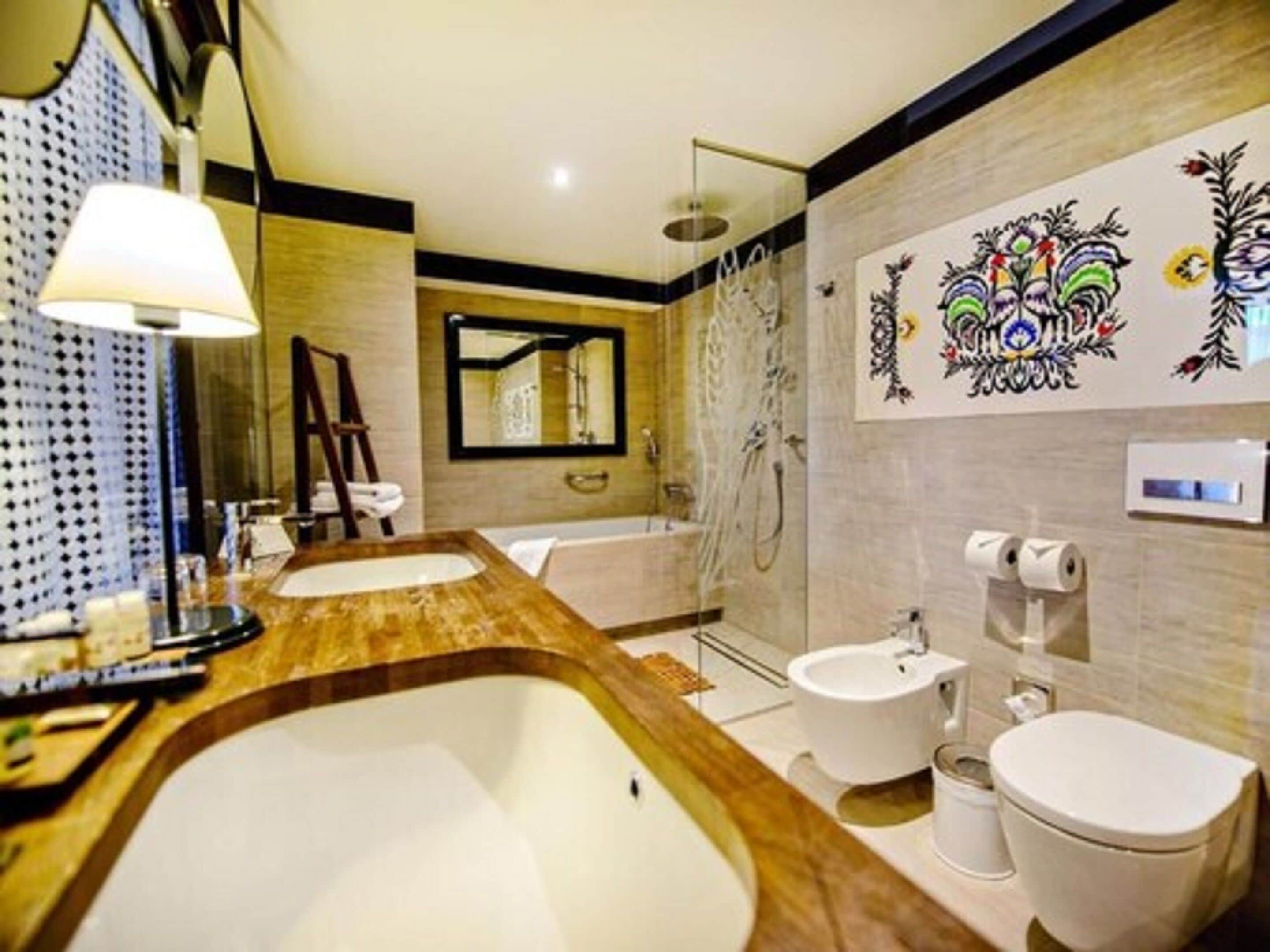 senior suite | bathroom | rainfall showerhead, designer toiletries, hair dryer, bathrobes