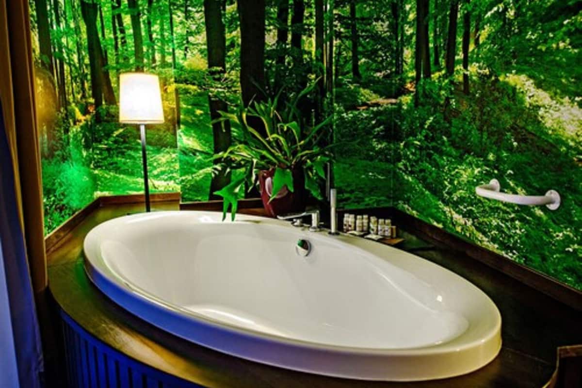 junior suite | bathroom | rainfall showerhead, designer toiletries, hair dryer, bathrobes