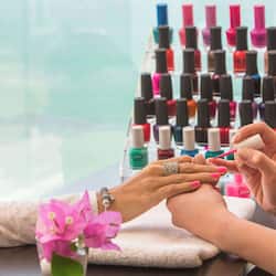 Guests can enjoy a professional manicure service with a wide selection of nail polish options.