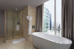 Junior Room, City View | Bathroom amenities | Combined shower/tub, rainfall showerhead, free toiletries, hair dryer