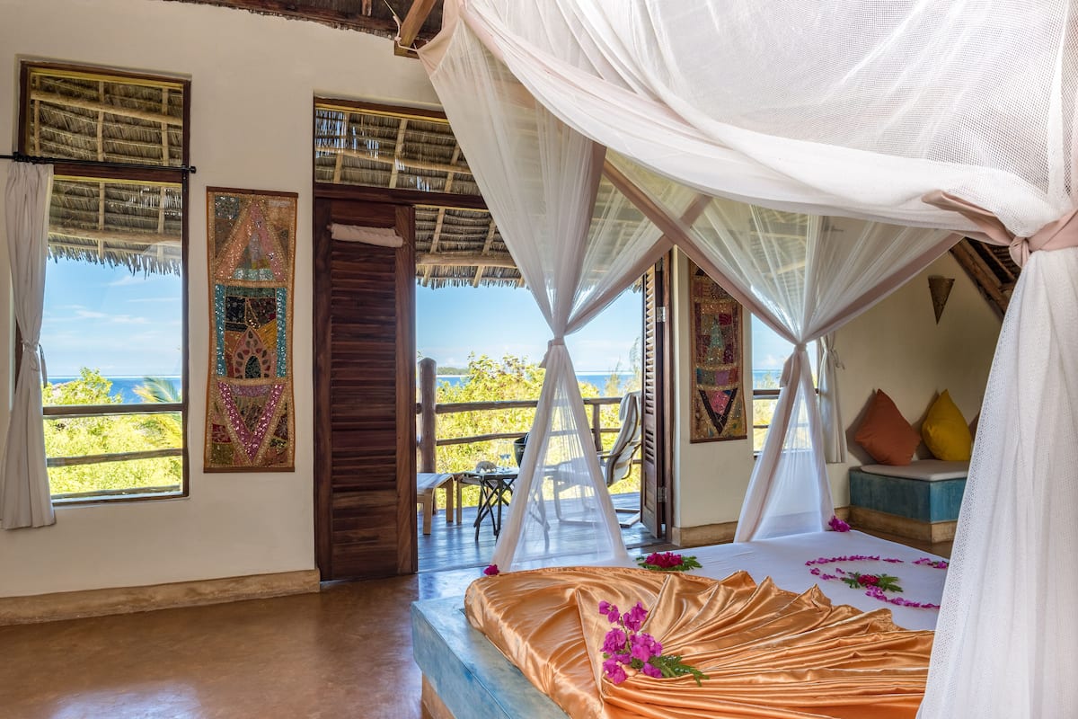 Family Suite with Partial Ocean View | 1 bedroom, down comforters, minibar, in-room safe