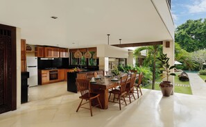 Enjoy meals in the kitchen and dining area with a stove and large island.