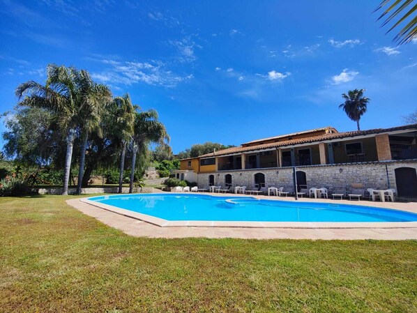 Outdoor pool, pool umbrellas, pool loungers